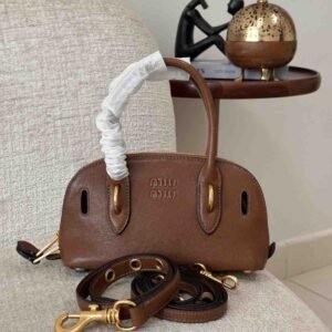 Shop Miu Miu Aventure Bag Top-handle Brown Leather